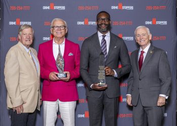 This is a group of people holding Crime Stoppers awards