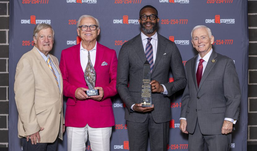 This is a group of people holding Crime Stoppers awards