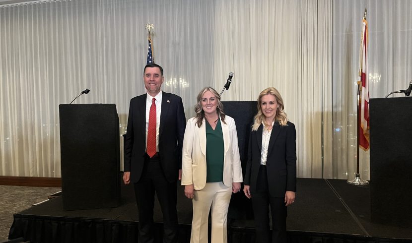 This is a picture of Jay Mitchell, Pamela Casey and Katherine Robertson standing together.