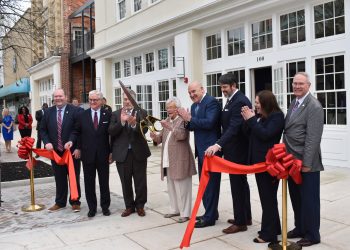This is a picture of Kay Ivey cutting a ceremonial ribbon.