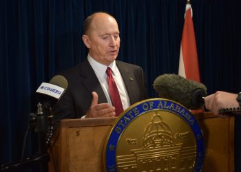 This is a picture of Reed Ingram speaking at a podium.