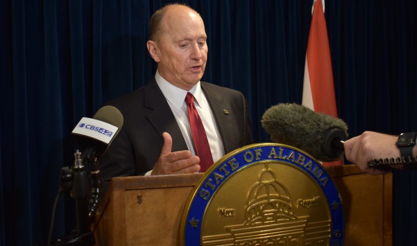 This is a picture of Reed Ingram speaking at a podium.