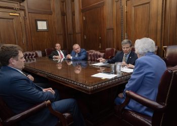 This is a picture of Kay Ivey talking to law enforcement leaders.