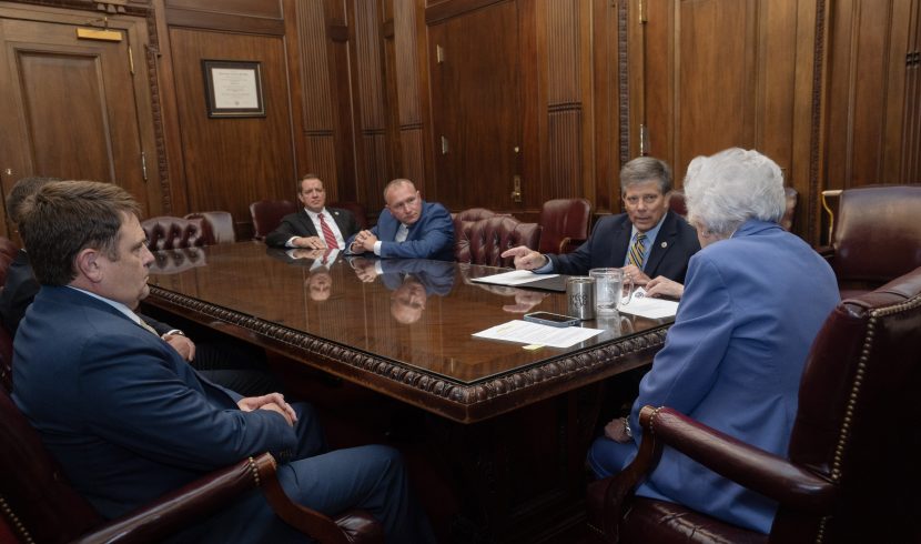 This is a picture of Kay Ivey talking to law enforcement leaders.