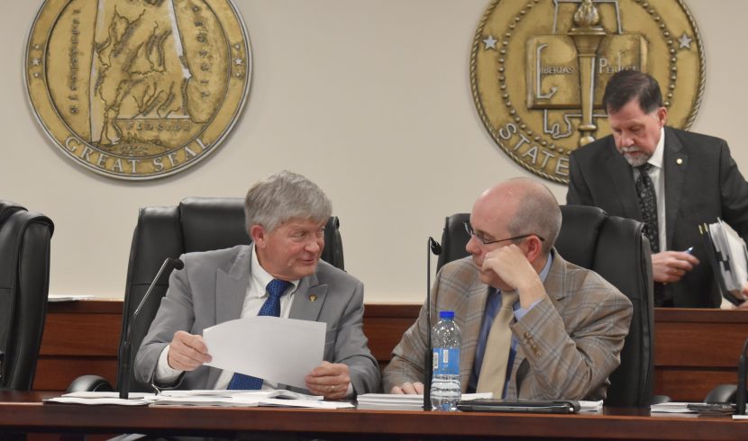 This is a picture of Greg Albritton talking to Clyde Chambliss.