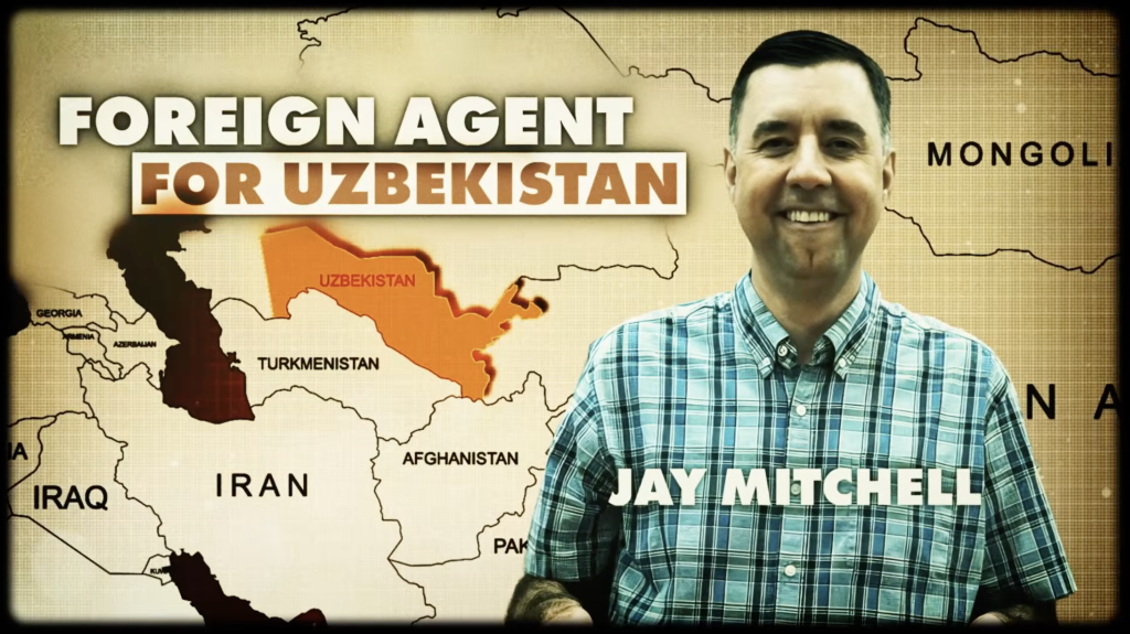 This is a picture of Jay Mitchell next to a map of Uzbekistan with the words "FOREIGN AGENT FOR UZBEKISTAN."